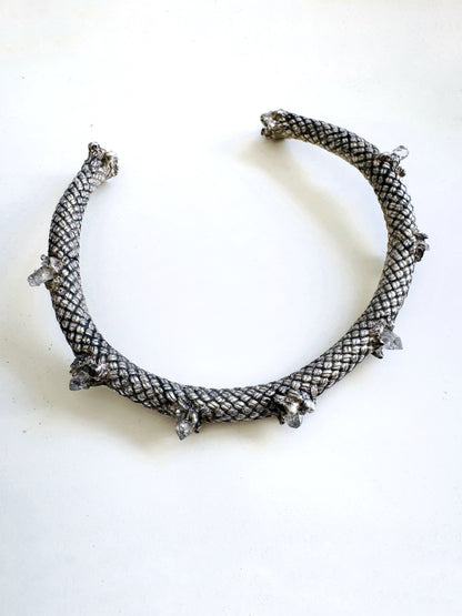 Silver necklace on a white background by Angela Lago